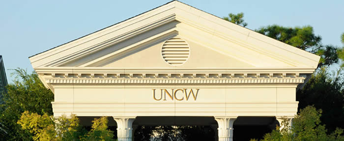 Picture of UNCW Campus with House Logo