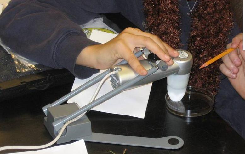 Student performs an experiment with a Proscope