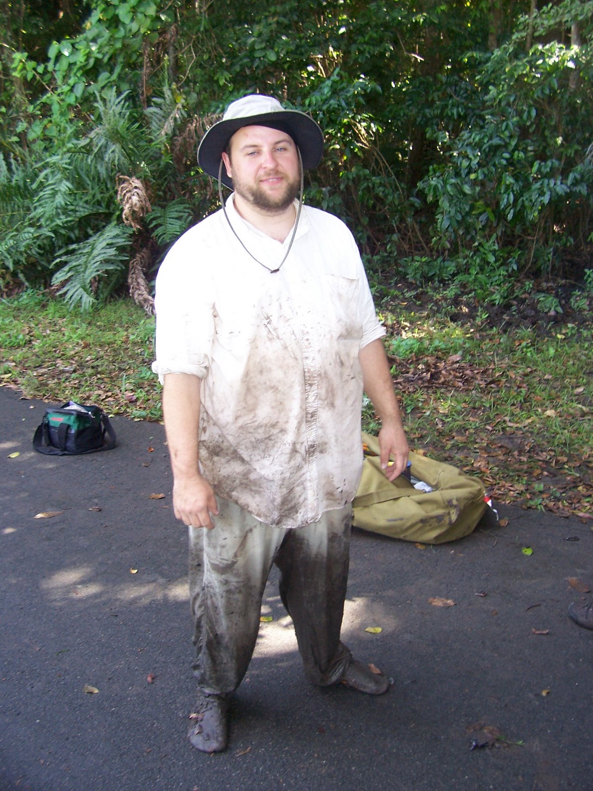PCRG researcher covered in mud after fieldwork
